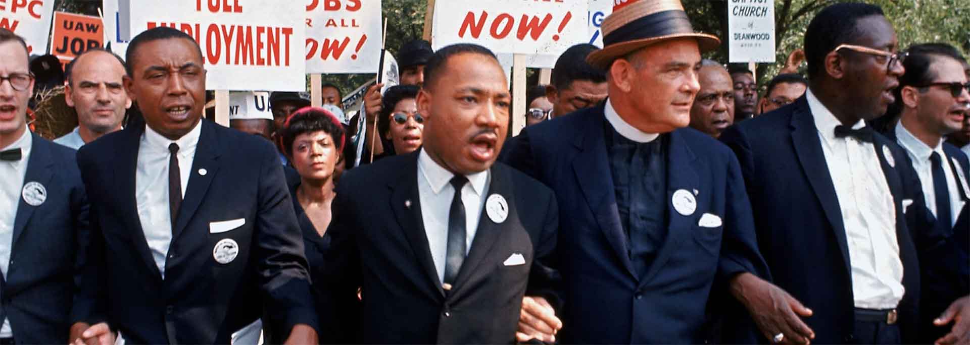 
		MLK marching with protestors.		